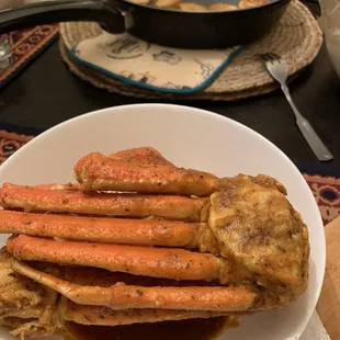 1 lb. Alaskan Snow Crab in Cajun sauce. It was takeout, don&apos;t mind the pan in the background.