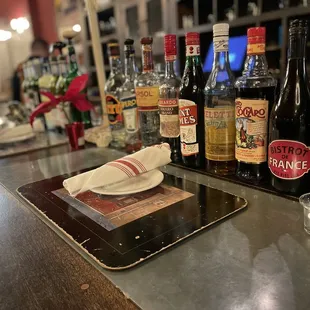 a bar with a variety of alcohols