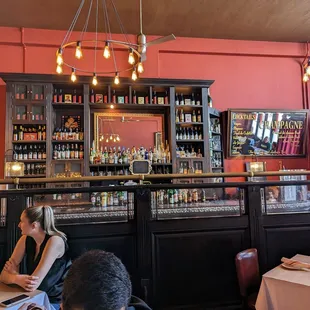 people sitting at tables in a restaurant