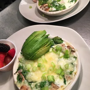 Healthy Skillet. Egg whites with veggies and Swiss cheese baked in ceramic dish, topped with fresh avocado. Includes a side of fresh fruit.