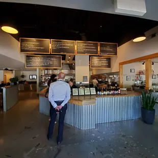 a man standing in front of a counter