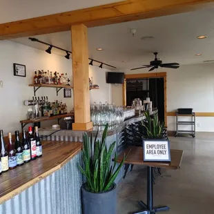 a bar with a lot of bottles of wine