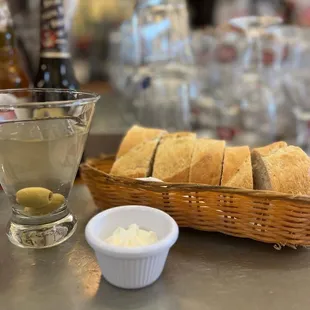 a basket of bread and olives