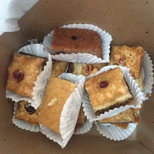 Baklavas and two basboosa . They had pistachio, walnut, pecan, and almond bases baklava and enjoyed them all