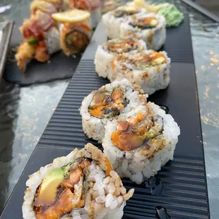 a row of sushi rolls