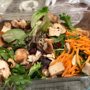 a salad in a plastic container