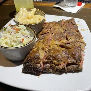 a plate of ribs and coleslaw