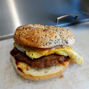 Sausage egg cheese on everything bagel