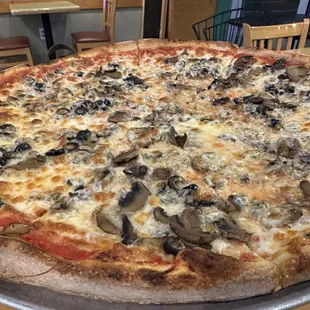 Custom 18&quot; pizza with mushrooms and olives .