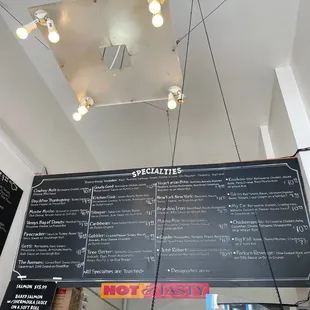 a menu on a blackboard in a restaurant