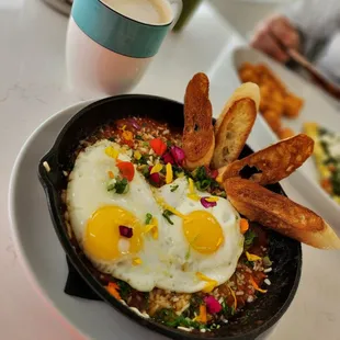 Shakshuka with a salted caramel latte. In the background, matcha lemonade and Mediterranean omlette with tator tots.