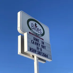 a sign for bites grill and bar