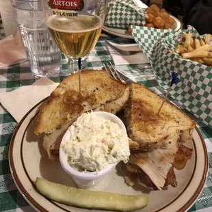 a plate of food and a glass of wine