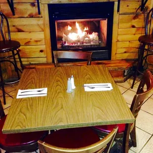 Enjoy a bite to eat by the fireplace where it&apos;s nice and warm while it&apos;s cold and snowy outside!