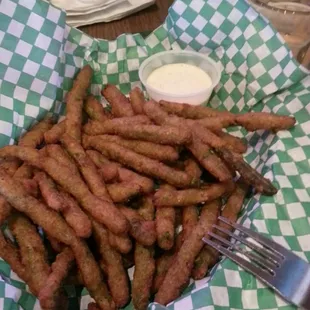 Delicious fried green beans with chipotle ranch dipping sauce.