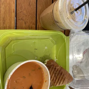 Half sandwich and soup combo plus tall iced coffee - pesto chicken panini and tomato basil soup. All delicious!