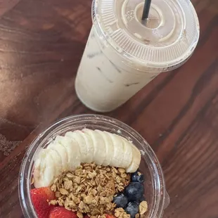 a yogurt with granola, strawberries, and bananas