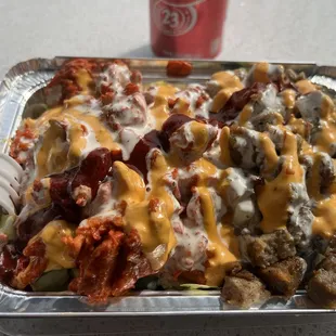 a tray of food with meat and cheese