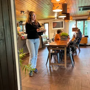 a woman standing in a kitchen