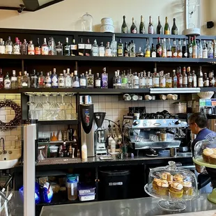 a man behind a counter in a restaurant