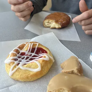 Maple glaze , apple fritter and raspberry cream cheese danish