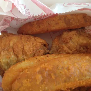 One thigh and one leg with potato wedges and a drink. Hot and fresh. Could have used some hot sauce.