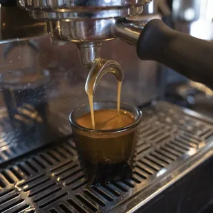 coffee being poured into a cup