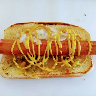 a hot dog with mustard