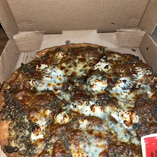 a pizza in a cardboard box
