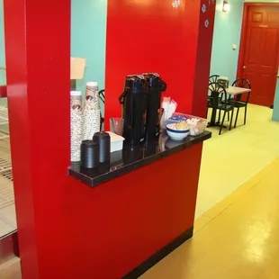 a red counter with a black countertop