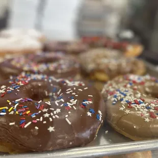 chocolate frosted donuts with sprinkles
