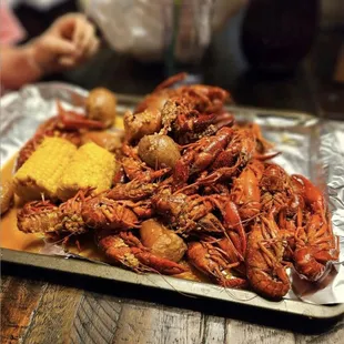 Cajun Kitchen featuring Louisiana Crawfish, Shrimp, Crab and all the sides: Corn, Potatoes, and Saus