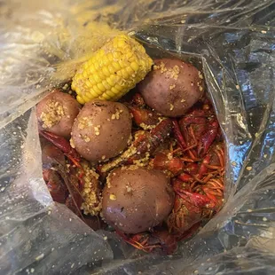 Crawfish, potatoes and corn