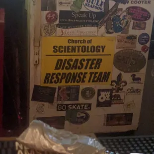 a refrigerator covered in stickers