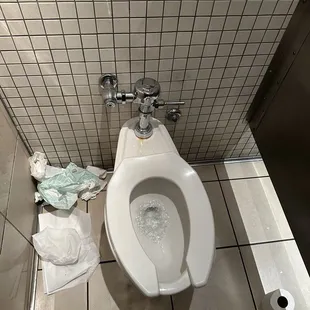 a toilet in a stall