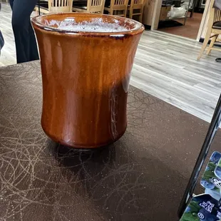 a large wooden bucket with ice in it
