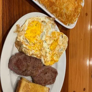 Steak and eggs. Cooked to order. Hash browns were heaping.