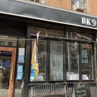 a bicycle parked outside of a restaurant