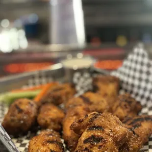 Traditional wings in jacks honey hot , grilled then tossed in their signature BKDS rub