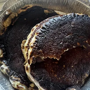 a pan of pancakes with chocolate toppings