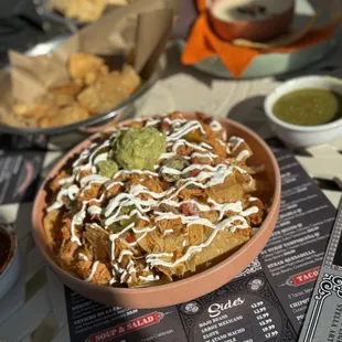 a plate of nachos on a table