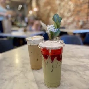 The Iced Strawberry Shortcake Matcha and the Iced Pistachio Baklava Latte, both with oat milk.