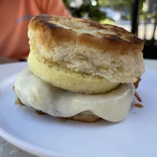 a biscuit sandwich on a white plate