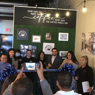 Black and White one-year anniversary ribbon cutting ceremony.