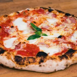 a pizza on a wooden table