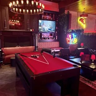 a pool table and couches