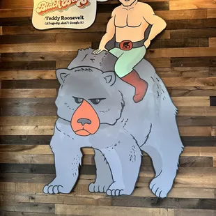 a man sitting on a bear