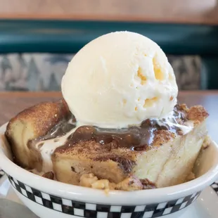 a bowl of bread pudding with ice cream