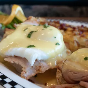 a plate of food with eggs and ham