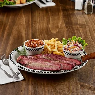 a plate of meat and fries